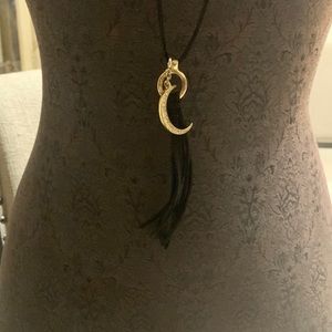 Black leather cord necklace gold tone with the rhinestones.